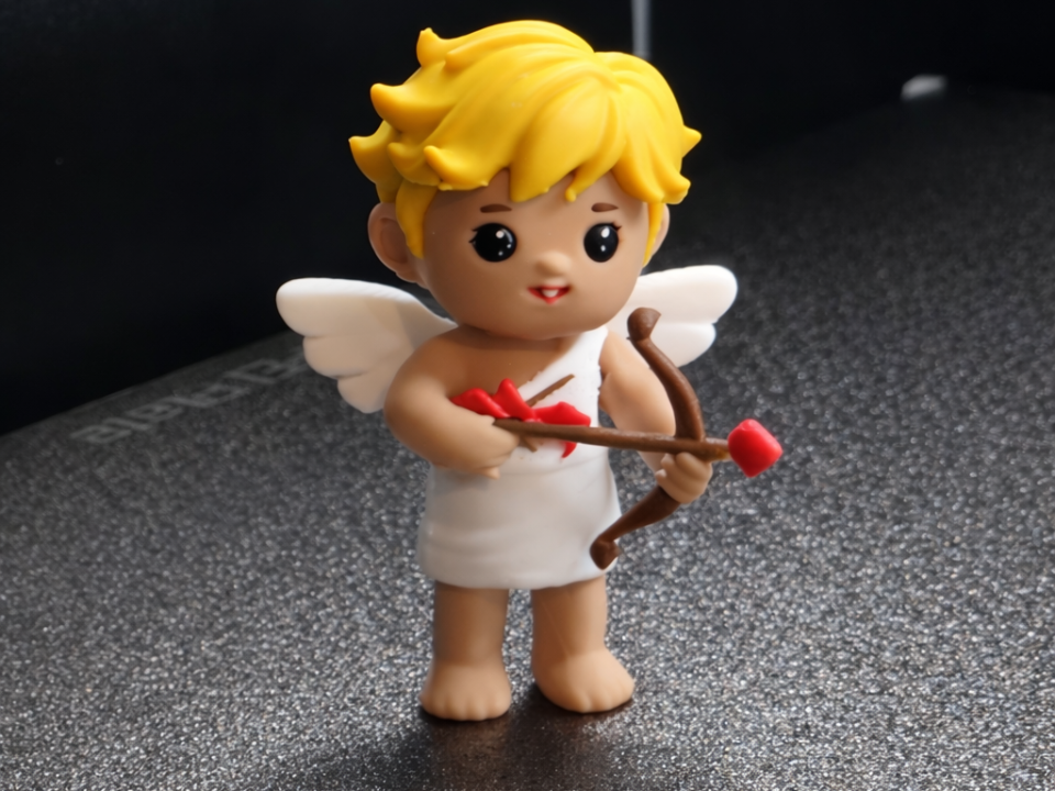 Cupid Figurine Holding Heart Arrow