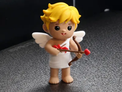 Cupid Figurine Holding Heart Arrow