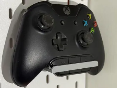 Shelf for Xbox controller with a headset adapter