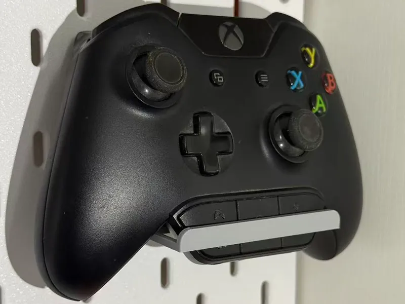 Shelf for Xbox controller with a headset adapter