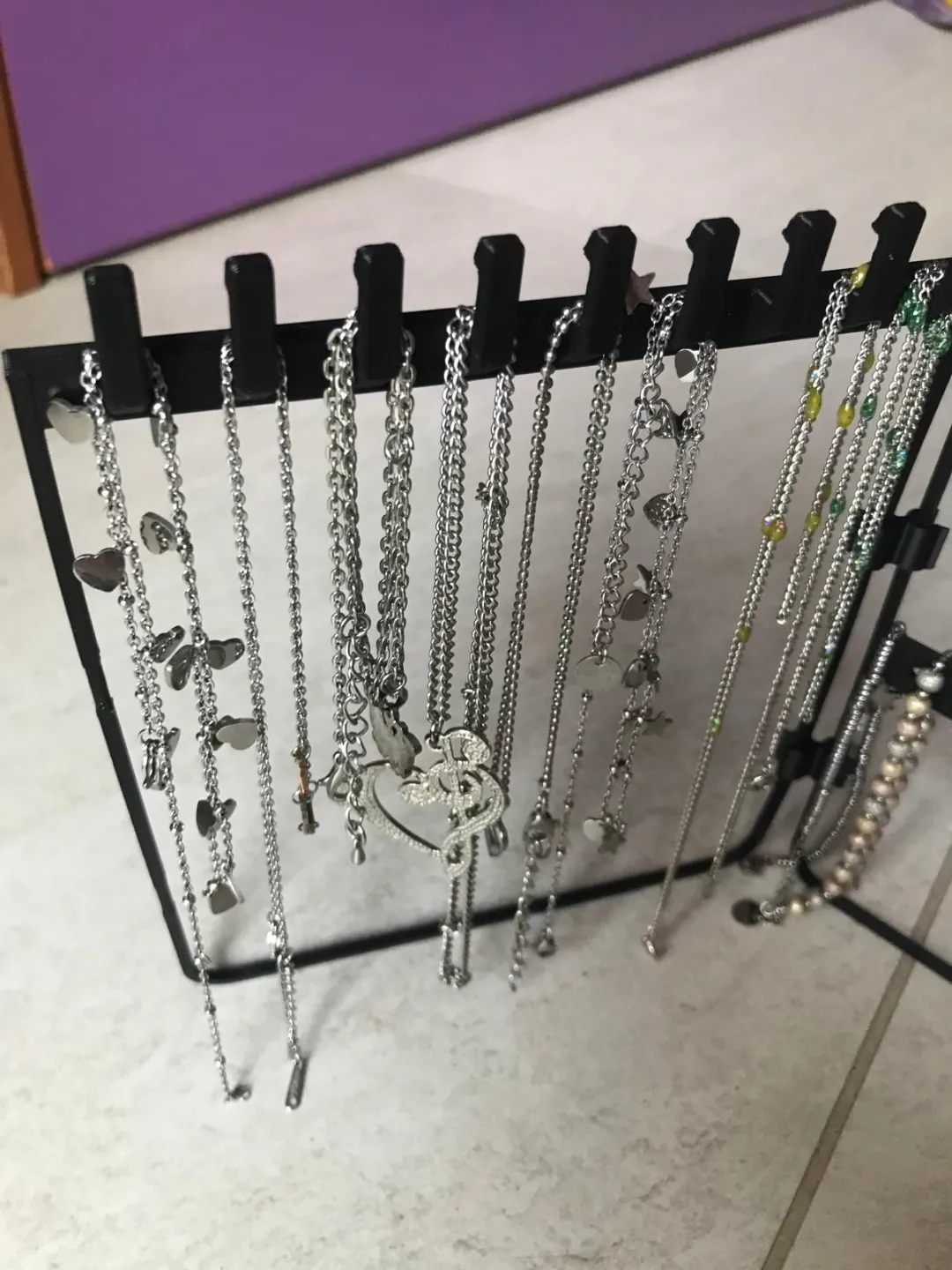 necklace holders, bracelets, earrings on the table view 3