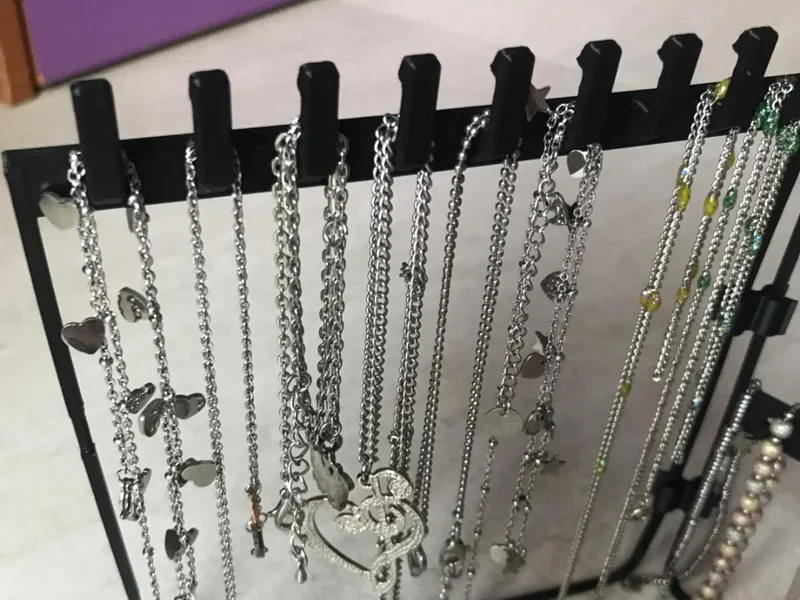necklace holders, bracelets, earrings on the table