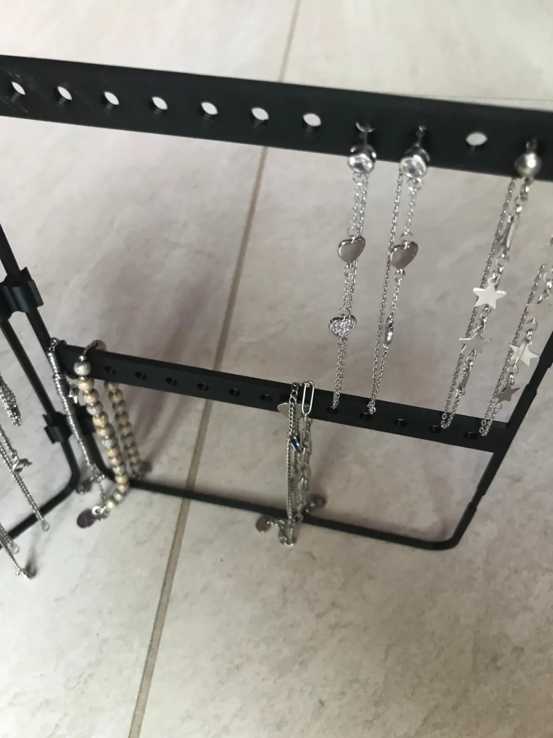 necklace holders, bracelets, earrings on the table view 4