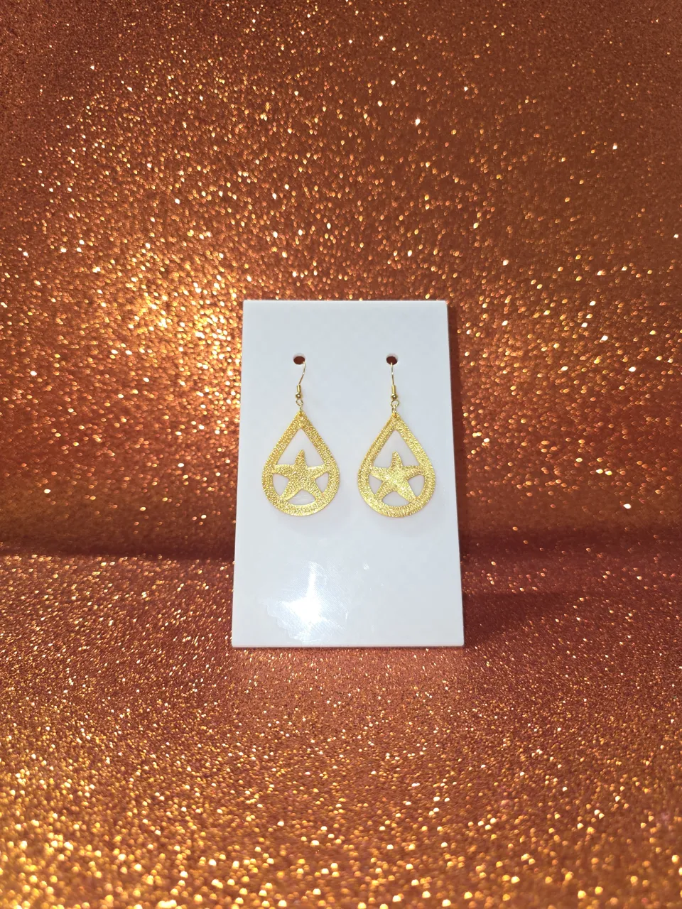 Star shimmering in the droplet earrings view 2