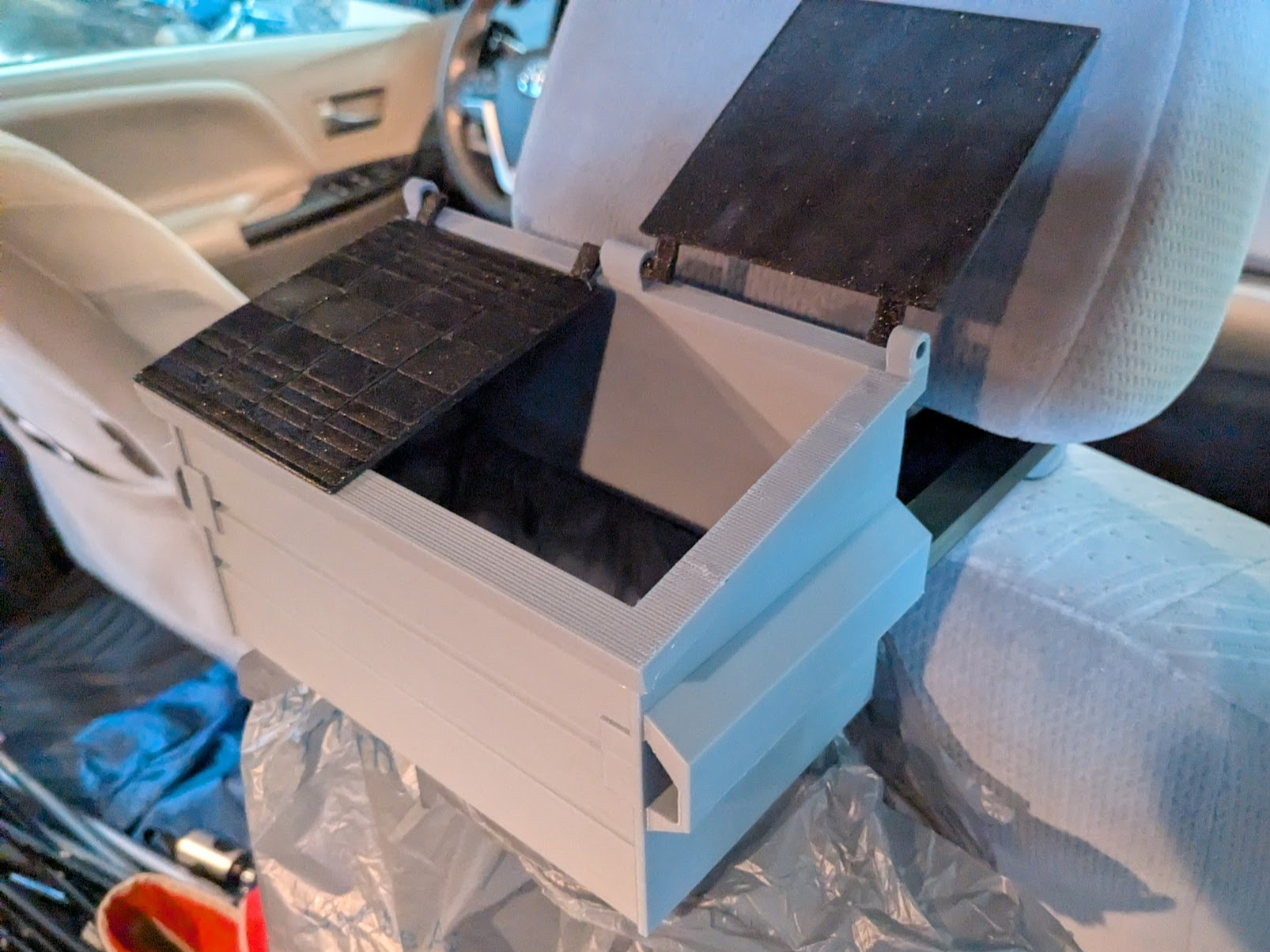 Dumpster trash can mounts to van head rest