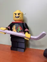 Brickman, 4 Color Hawks Logo, Toothless Grin & Hockey Stick