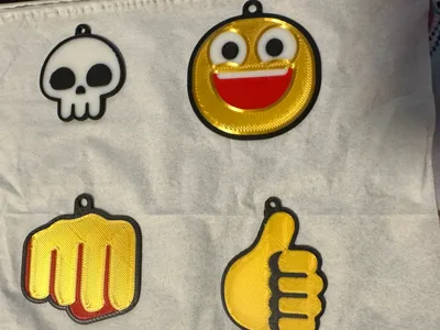 some flat emoji keychains