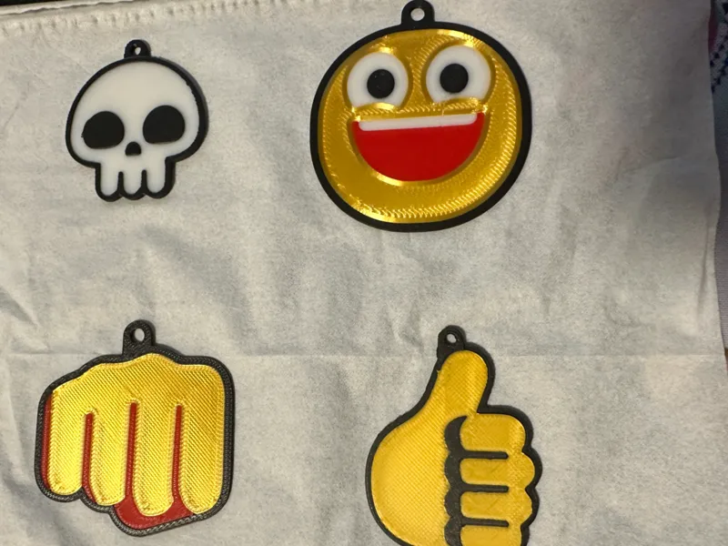 some flat emoji keychains