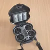 The box with the charger and 3 batteries