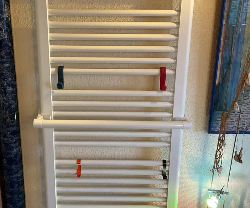 Another towel rail that is height-adjustable without locking into place. Cheap and quick to produce