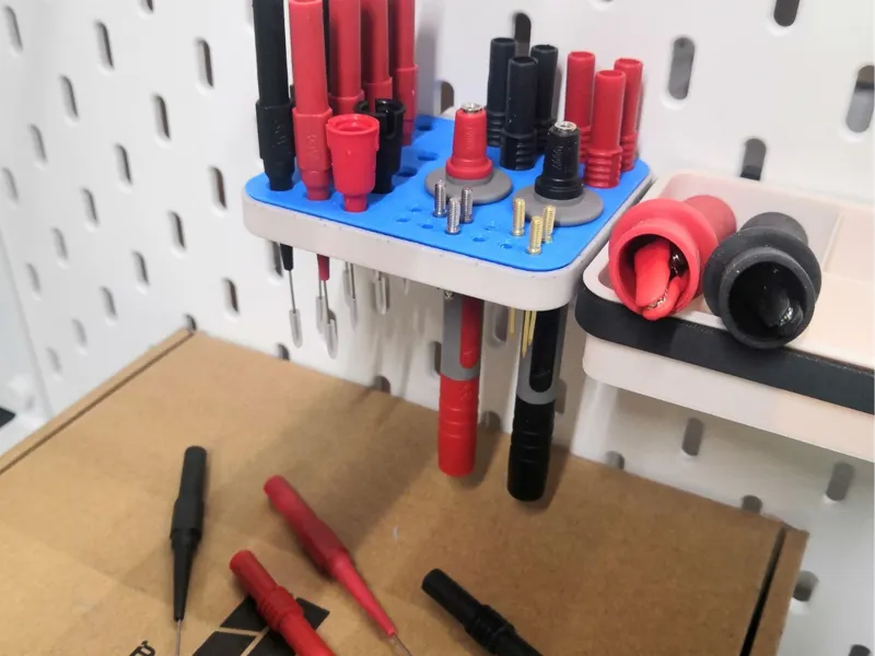 Probe organizer for a multimeter on a Skadis board