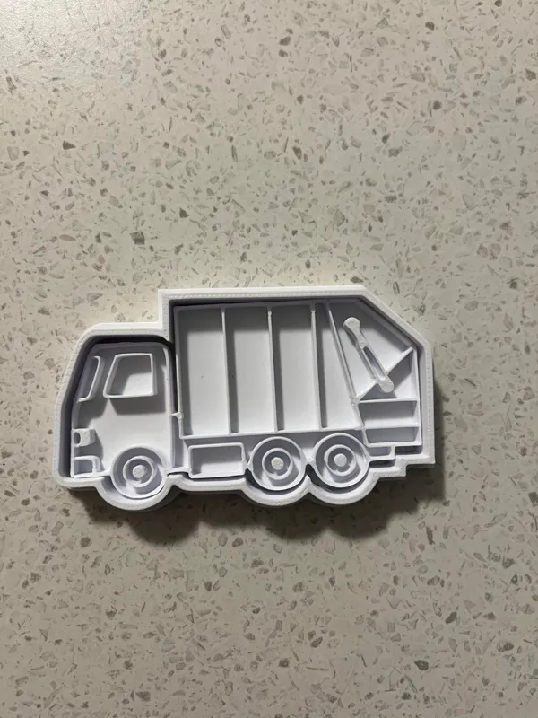 Emporte-pièce et tampon camion poubelle