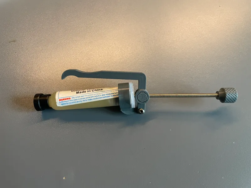 Flux syringe holder