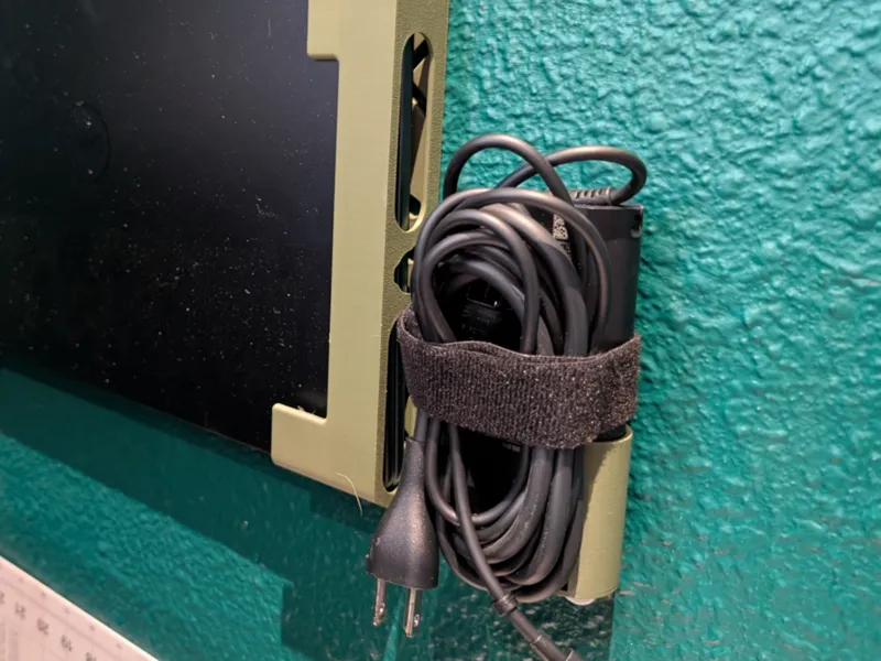 Wall Holder for Dell laptop charger.