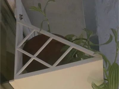 Hanging a flower pot on a window