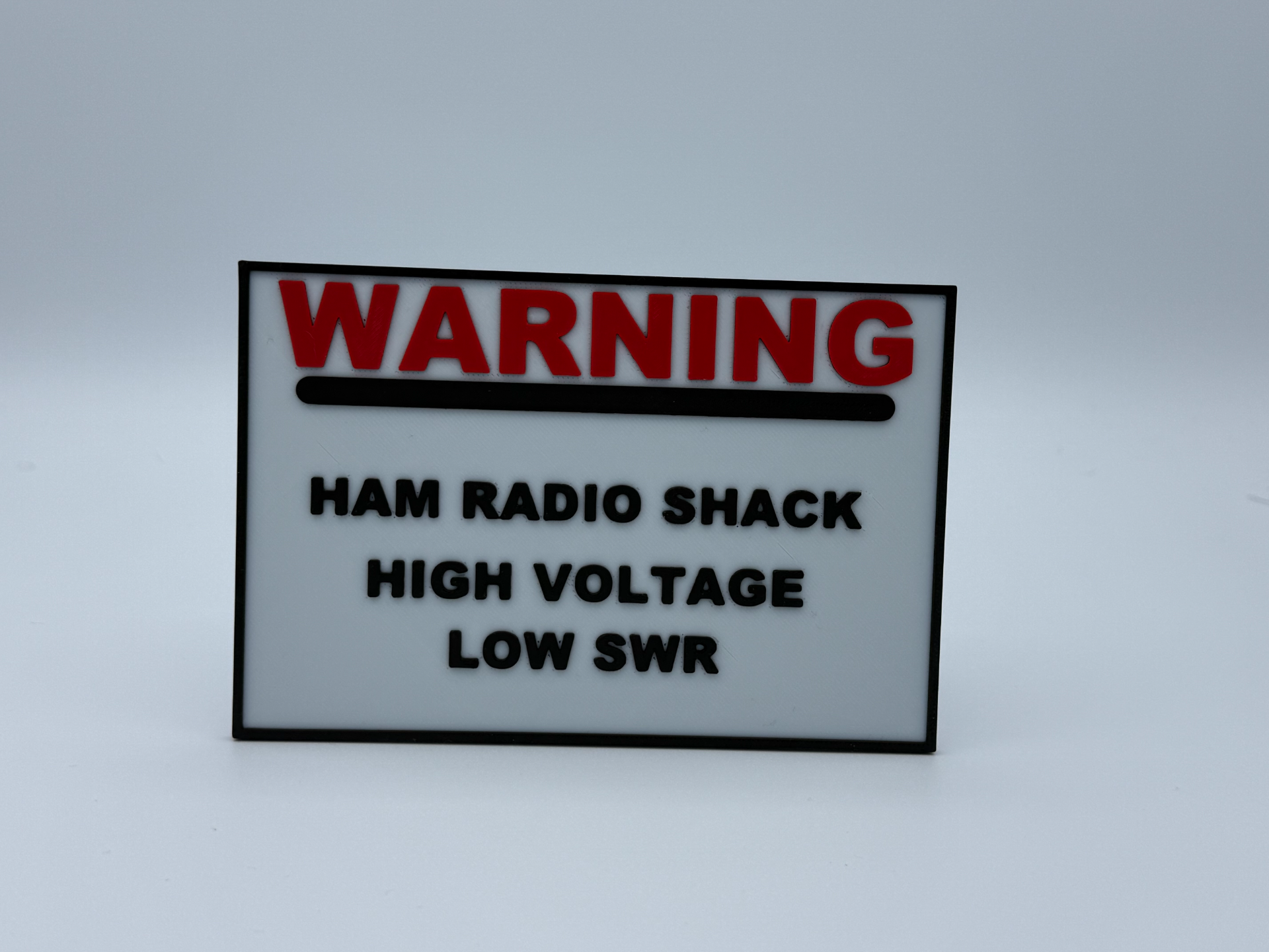 Ham radio sign High Voltage. Low SWR. Zero Chill