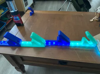 skateboard wall hanger with slot for hidden leds