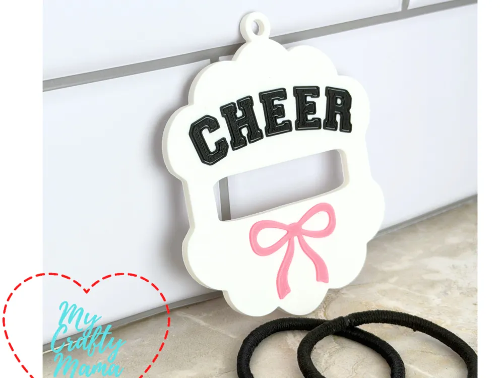 Accesorio para sujetar ligas de cabello: Cheer Scalloped hair tie keychain. Referencia del modelo original.