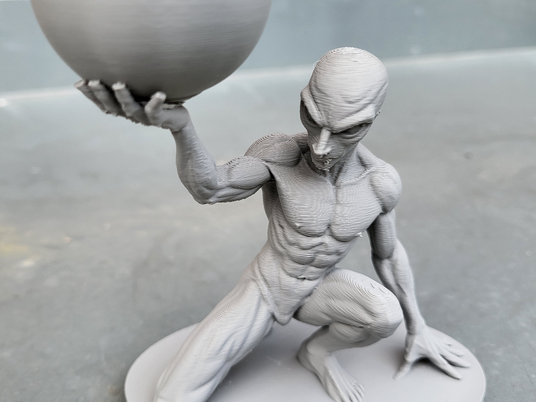 Grey Alien Holding a Sphere