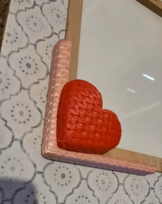 Knitted heart frame décor
