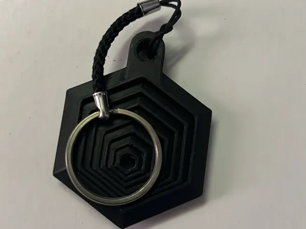 Petit porte-clés fidget hexagonal