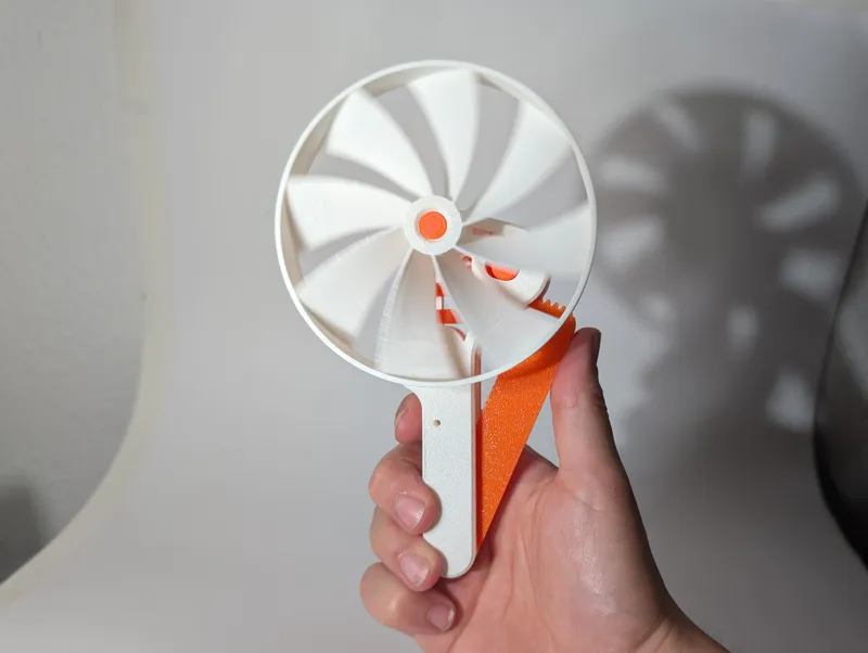 Squeeze Powered Flywheel Fan
