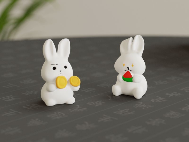 Two cute little bunnies with big appetites