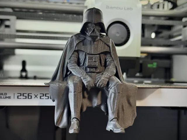 Sad Darth Vader sitting on a ledge figurine!