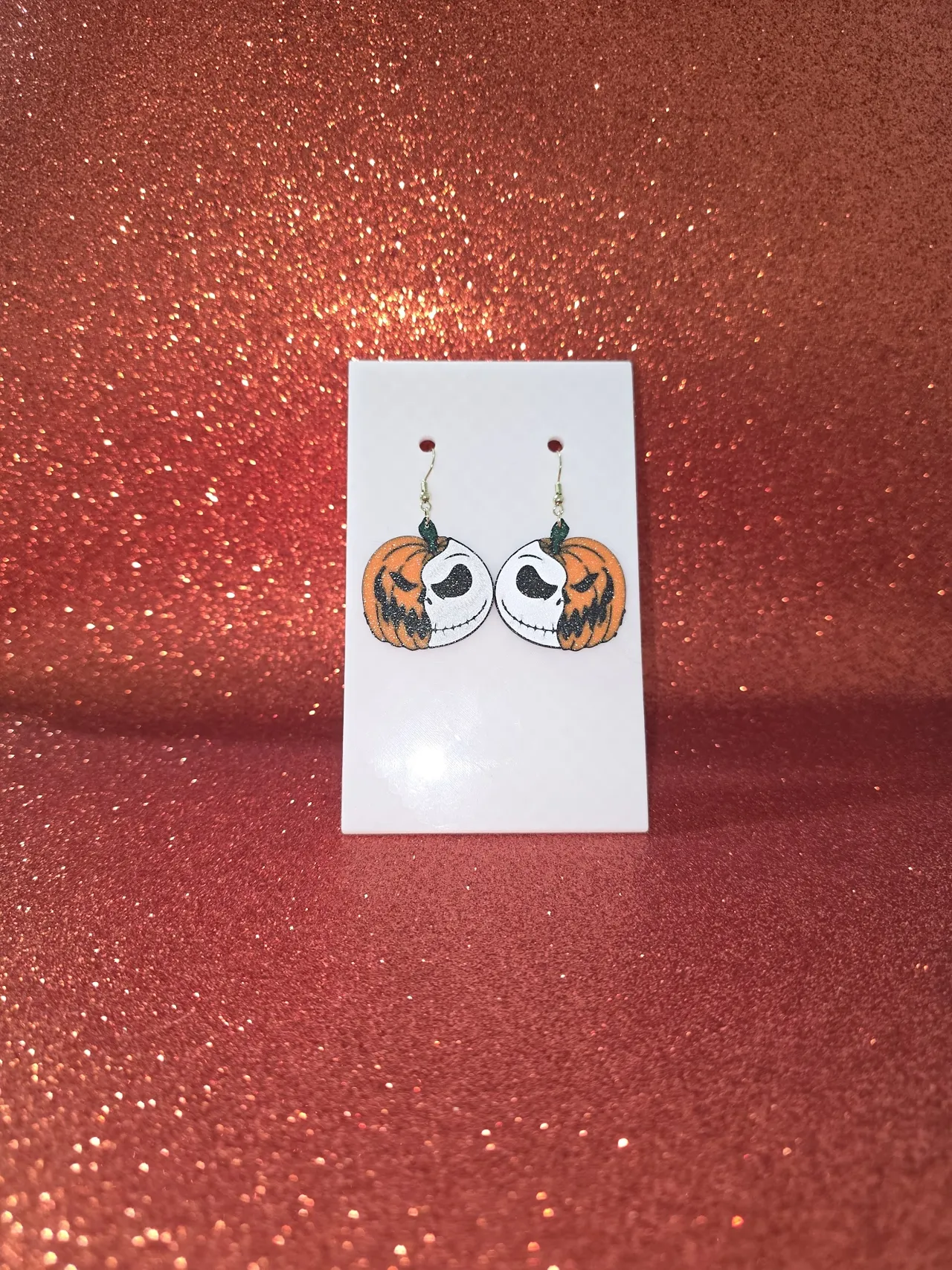 Skellington pumpkin earrings view 2