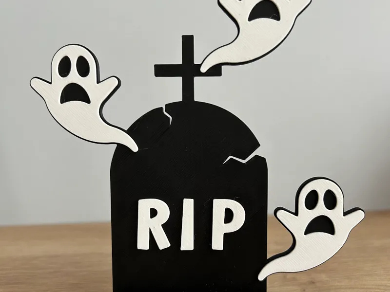 Halloween RIP tombstone with ghosts