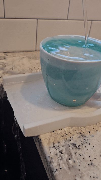 Modern tap overflow catcher.
