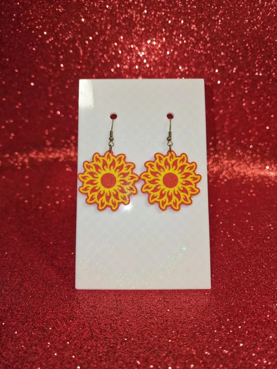 Flaming sun earrings view 2