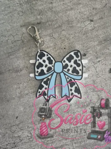 Accesorio para sujetar ligas de cabello: Cow Print Bow Hair Tie Holder Keychain — vista de referencia 5