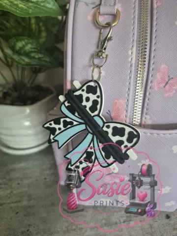 Accesorio para sujetar ligas de cabello: Cow Print Bow Hair Tie Holder Keychain — vista de referencia 4