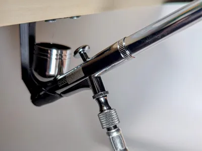 Under shelf airbrush holder