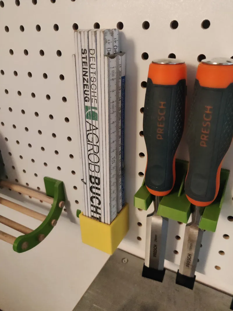 Folding rule holder for Pegboard