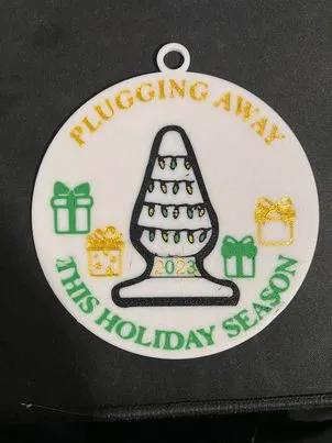 Pluggin away this holiday season ornament