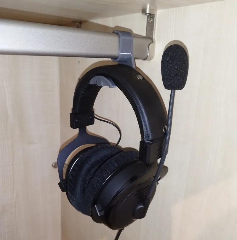 Headset holder for cabinet rail