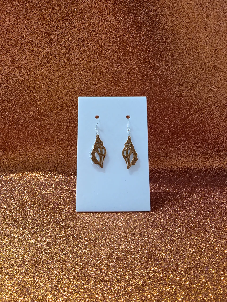 Triton shell earrings view 2