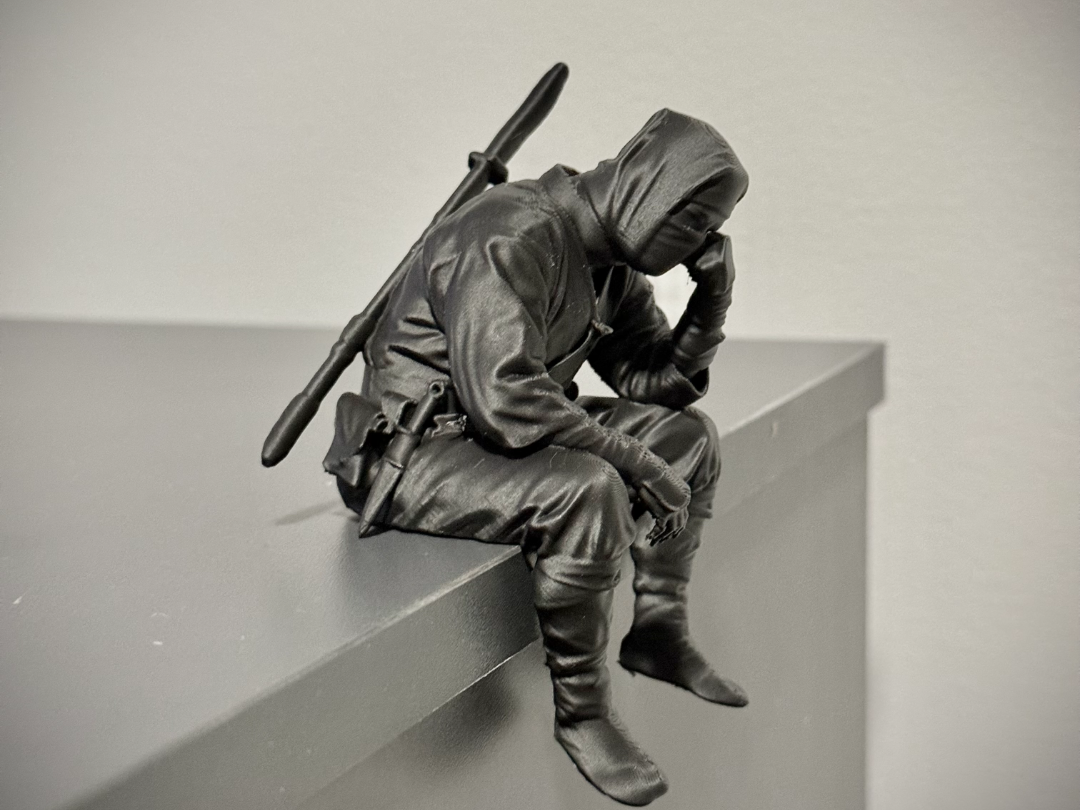 Sad Ninja sitting on a ledge Figurine!