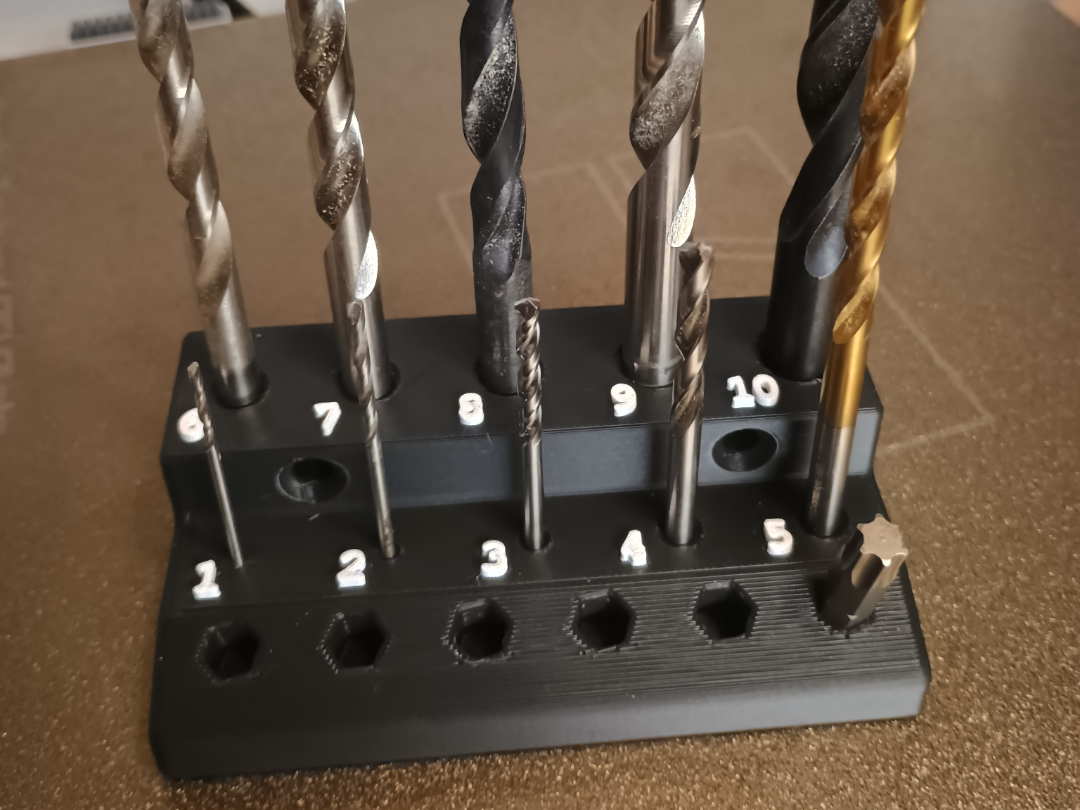Wall-mounted drill and bit holder