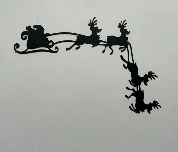 Père Noël d'angle de porte avec son renne