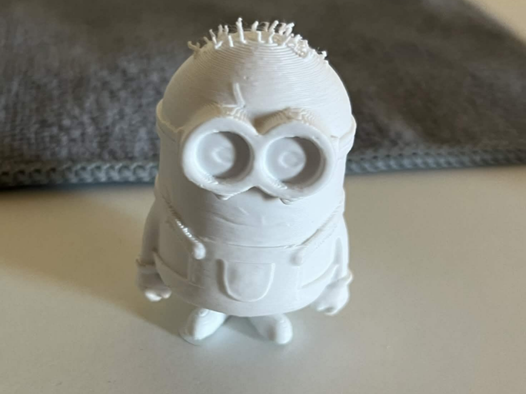 The Tiny Minion‑Like Character