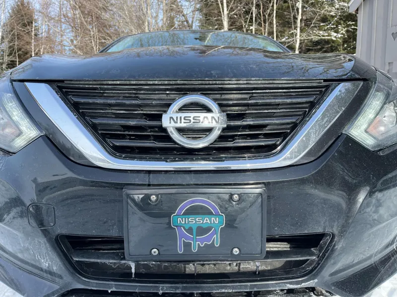 dripping nissan logo license plate