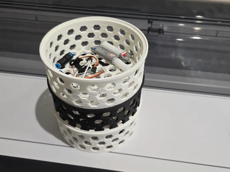 Stackable container with hexagonal decor
