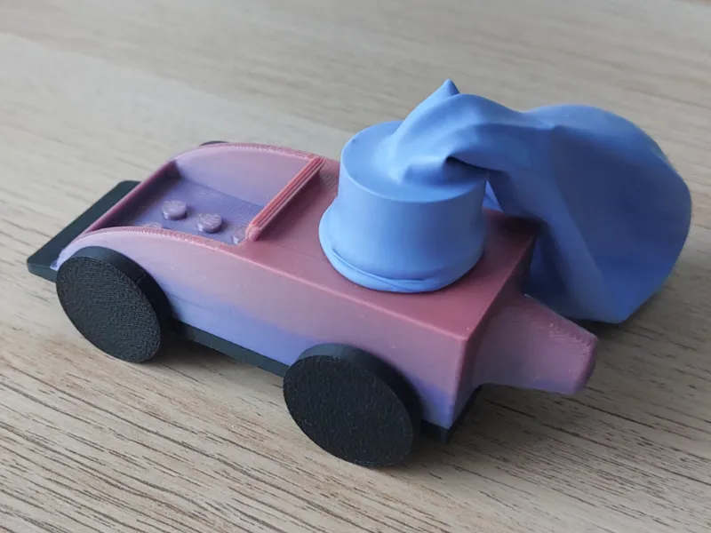 Balloon powered toy car with exhaust/blower