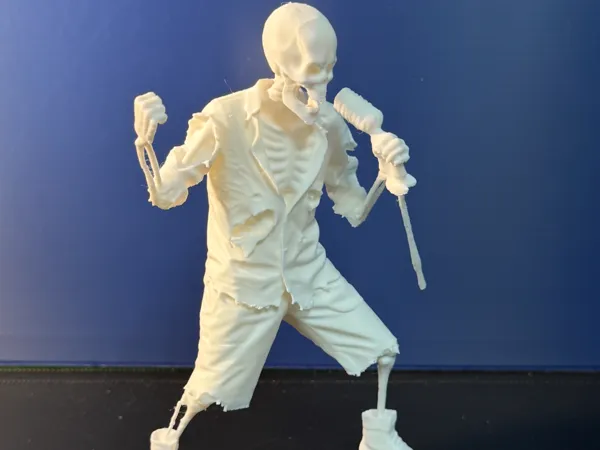 Figurine chanteur squelette de groupe de rock