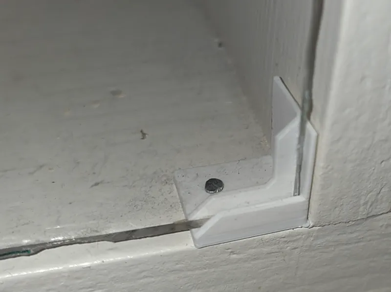 Plexiglass holder for a display cabinet