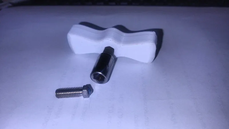 Exagonal nut driver key handle