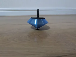 Crystal spinning top